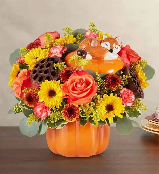 halloween decor ideas with posies in a pumpkin vase