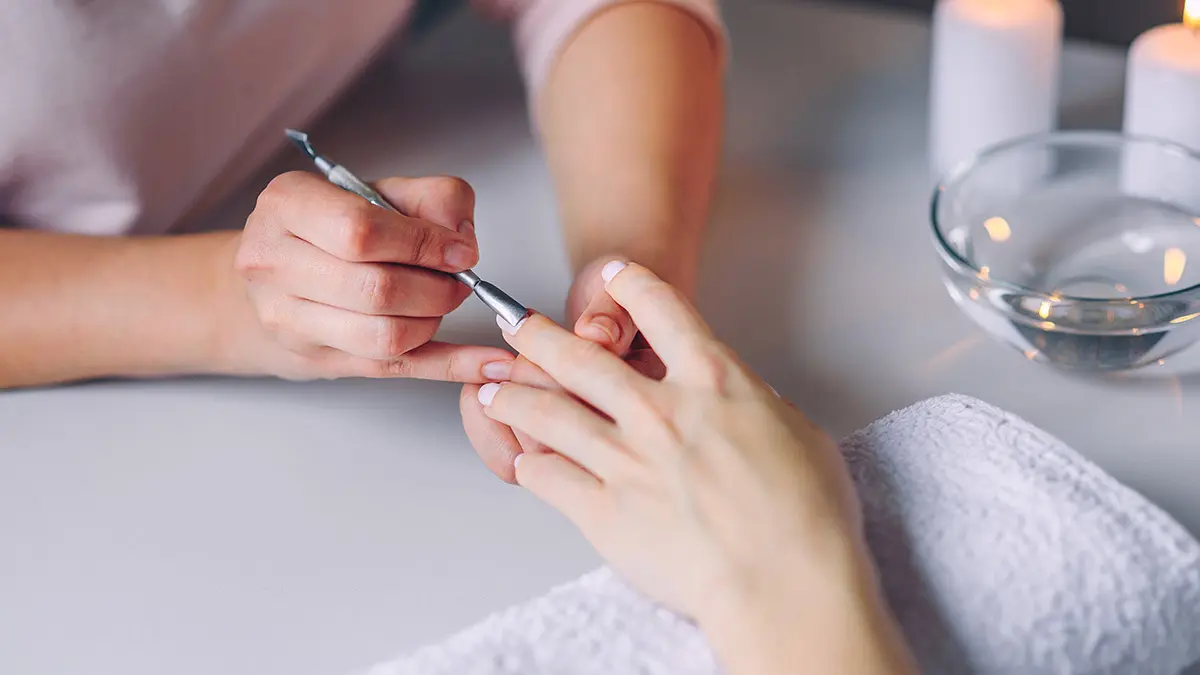 human connection with woman getting manicure