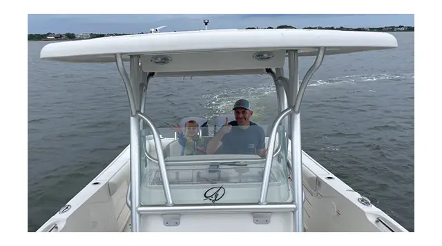 Curt and James McCann enjoy a boat ride 