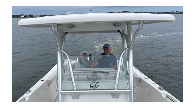 Curt and James Mc Cann enjoy a boat ride