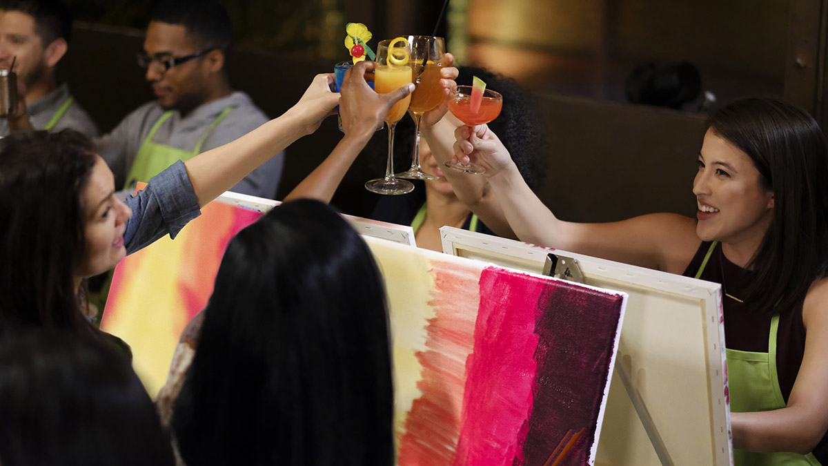 difficult anniversary with friends toasting at paint nite class