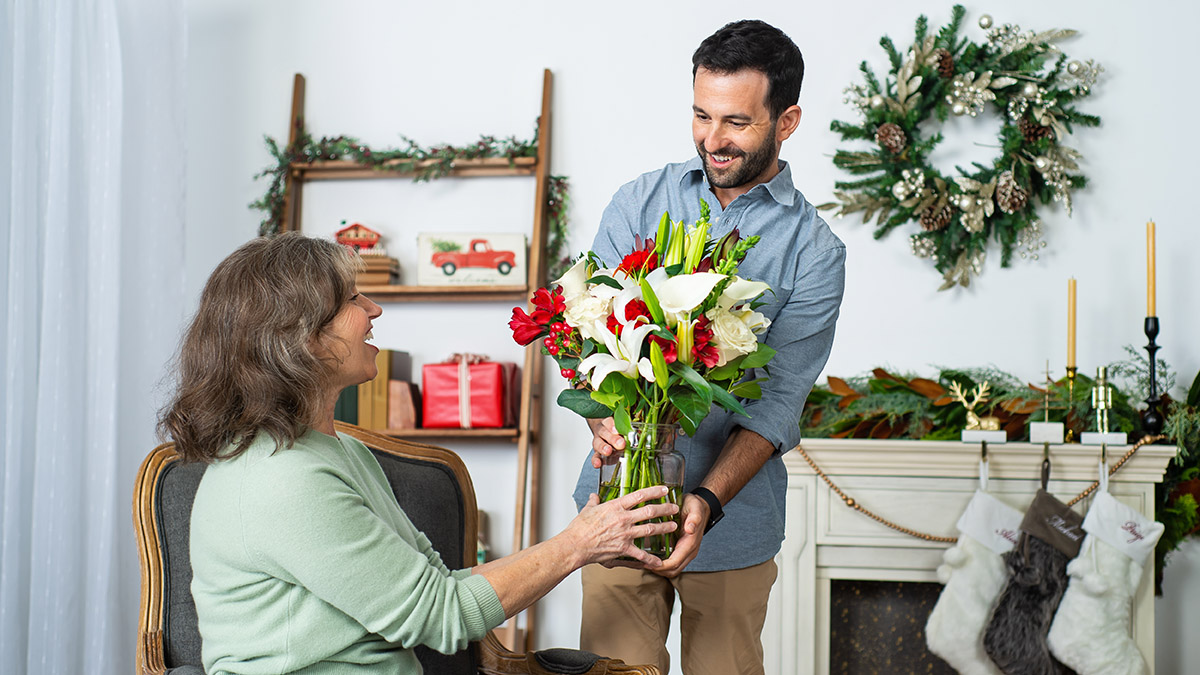 best hostess gift ideas with man handing hostess flowers