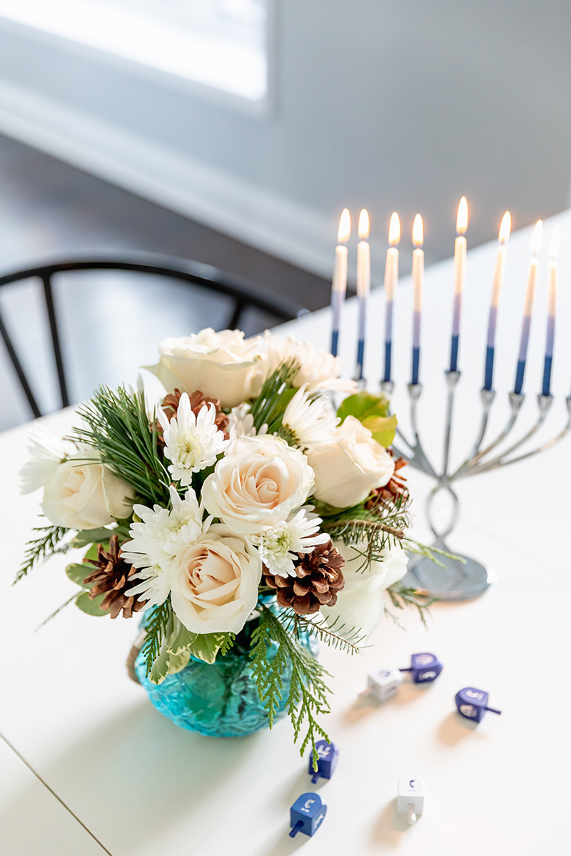 hanukkah with flowers and menorah