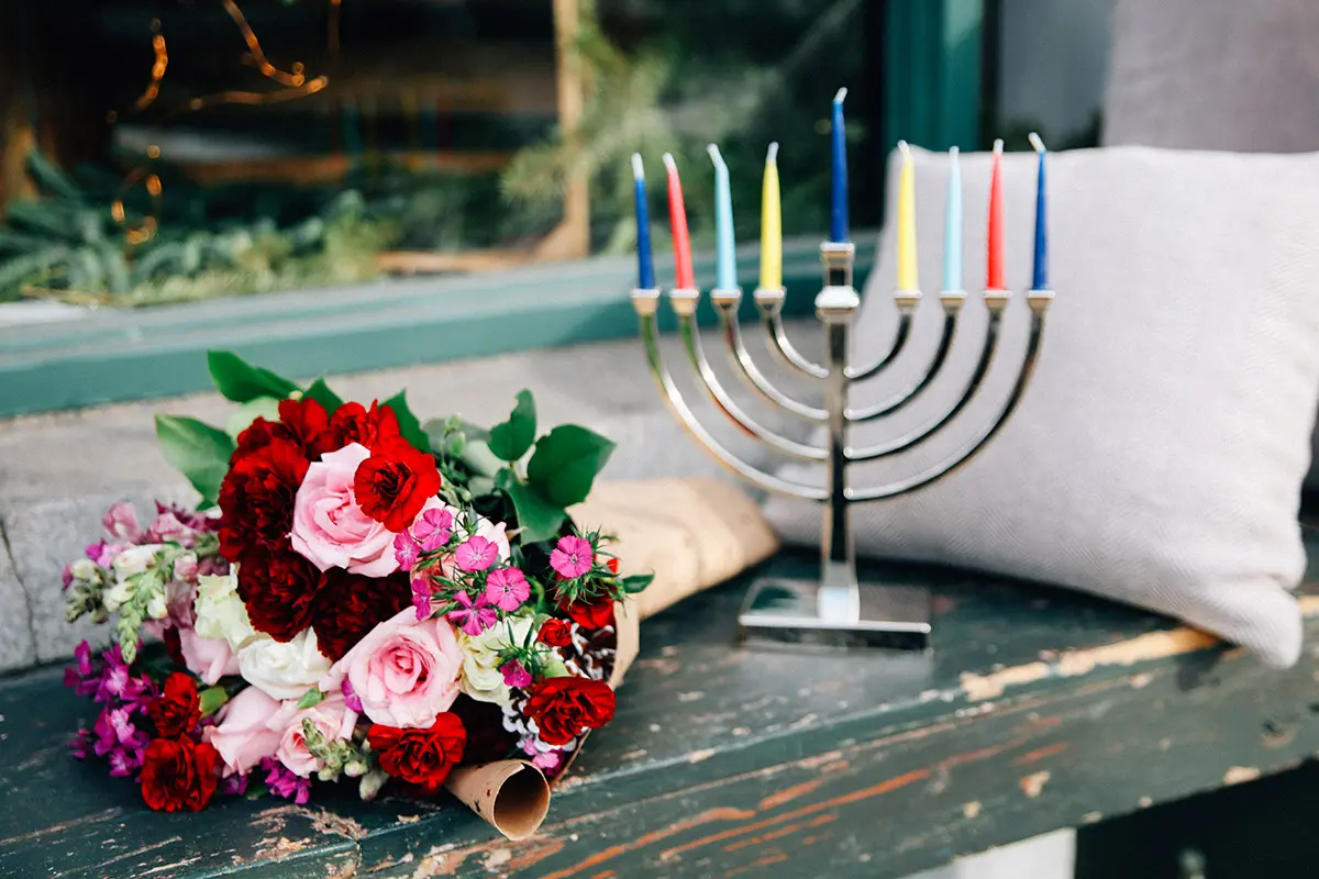 hanukkah with menorah and flowers