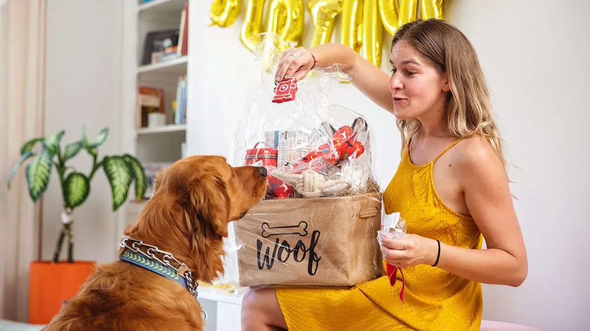 gifts for dog lovers with woman holding treat