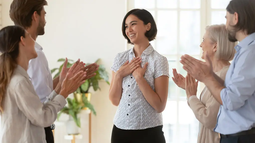 how to be more positive with co-workers congratulating colleague