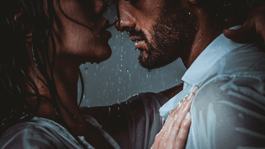 Quotes about love from movies with a couple hugging in the rain