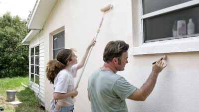 helping neighbor paint house