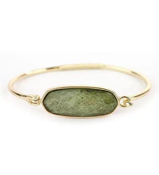 A blonde and her bag with Facet Stone Wire Bangle Bracelet Green Quartz