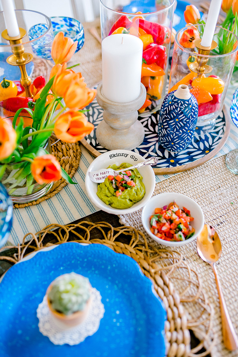 spring birthday party ideas with guac and salsa on a table.