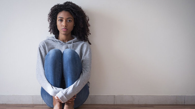 Young girl in trouble feeling sad and depressed