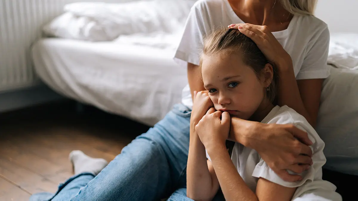 mental health awareness with mom comforting daughter