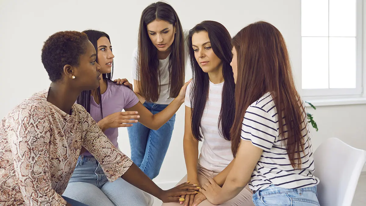 grieving with women supporting grieving friend