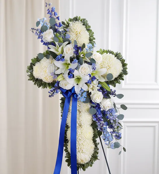 sympathy gift etiquette with blue and white standing cross