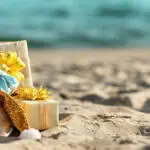 Santa Claus bag with gifts on beach