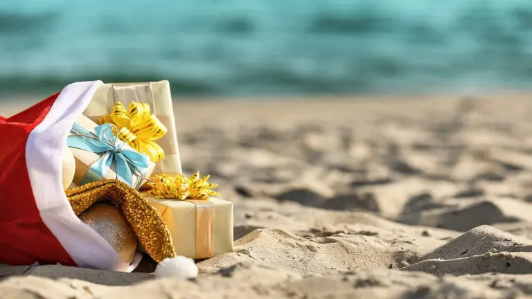 Santa Claus bag with gifts on beach