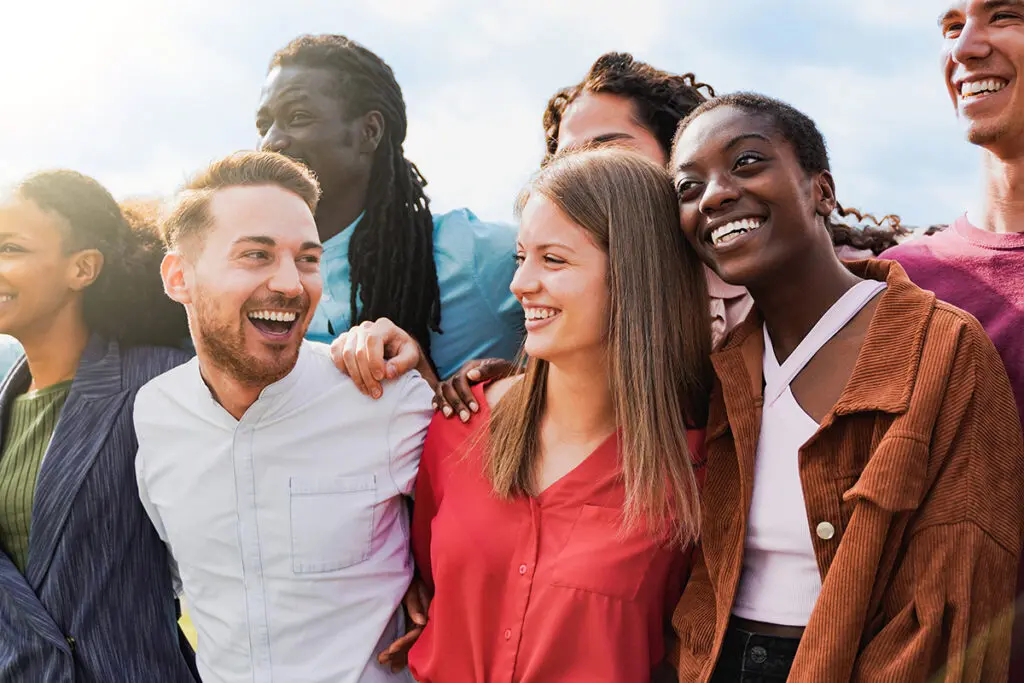 Diverse group of friends having fun smiling outdoor in summer day Young people celebrate holiday vacations outside