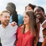 Diverse group of friends having fun smiling outdoor in summer day Young people celebrate holiday vacations outside