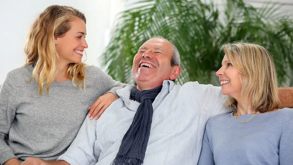 family having fun on sofa