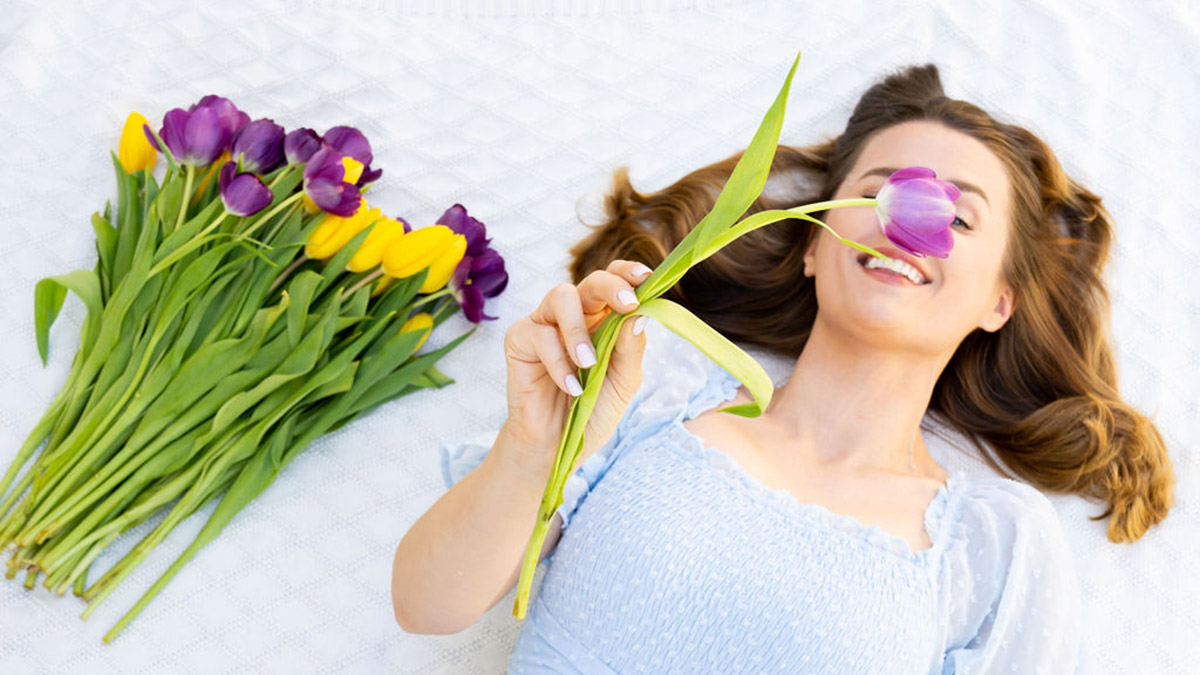 flower quotes women lying on ground holding tulip