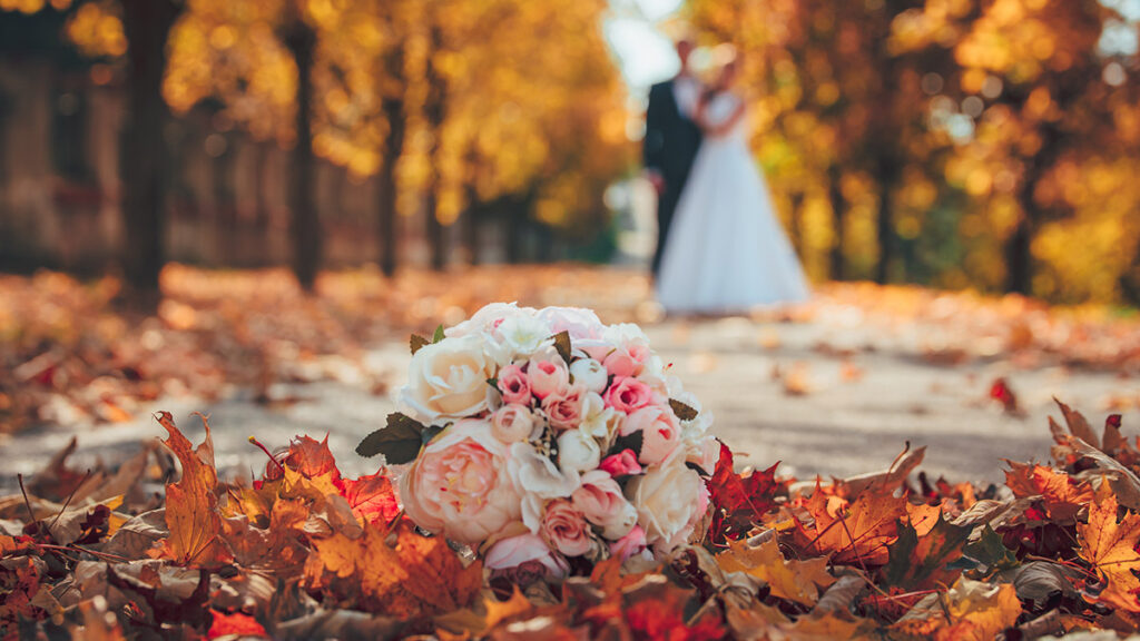 Wedding bouquet and wedding couple in orange park