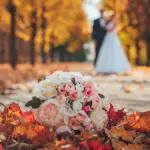Wedding bouquet and wedding couple in orange park