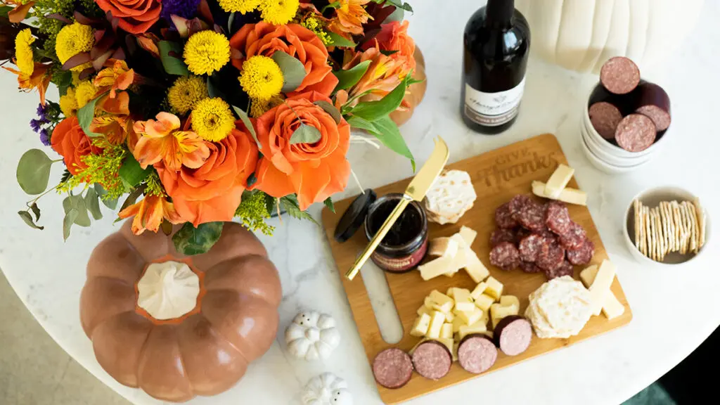thanksgiving checklist cheese crackers wine flowers