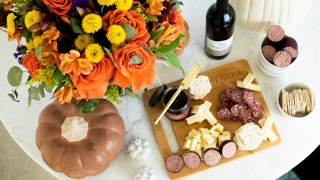 https://www.flowers.com/blog/wp content/uploads///thanksgiving checklist cheese crackers wine flowers x