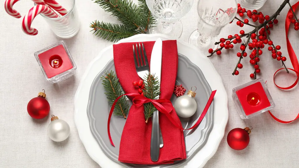 Festive table setting with beautiful dishware and Christmas deco