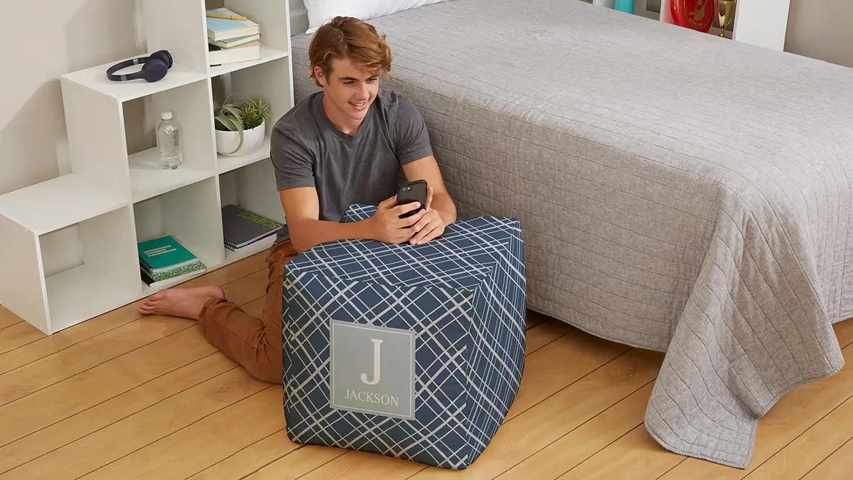 christmas gifts for teens teen boy playing on phone in bedroom