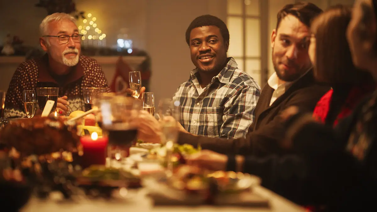 grief at the holidays with a family at the table for christmas dinner