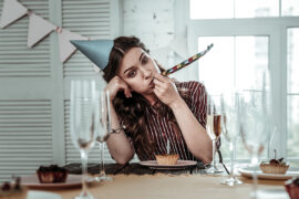 Upset drunk woman celebrating her birthday party alone
