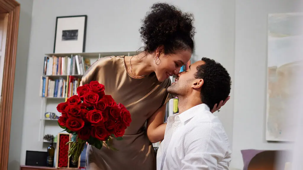 quotes about love couple kissing with roses