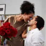 quotes about love couple kissing with roses