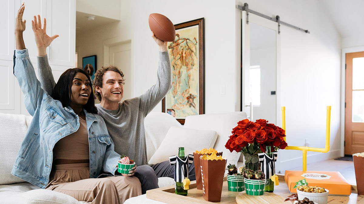 valentines day puns husband and wife celebrating watching football