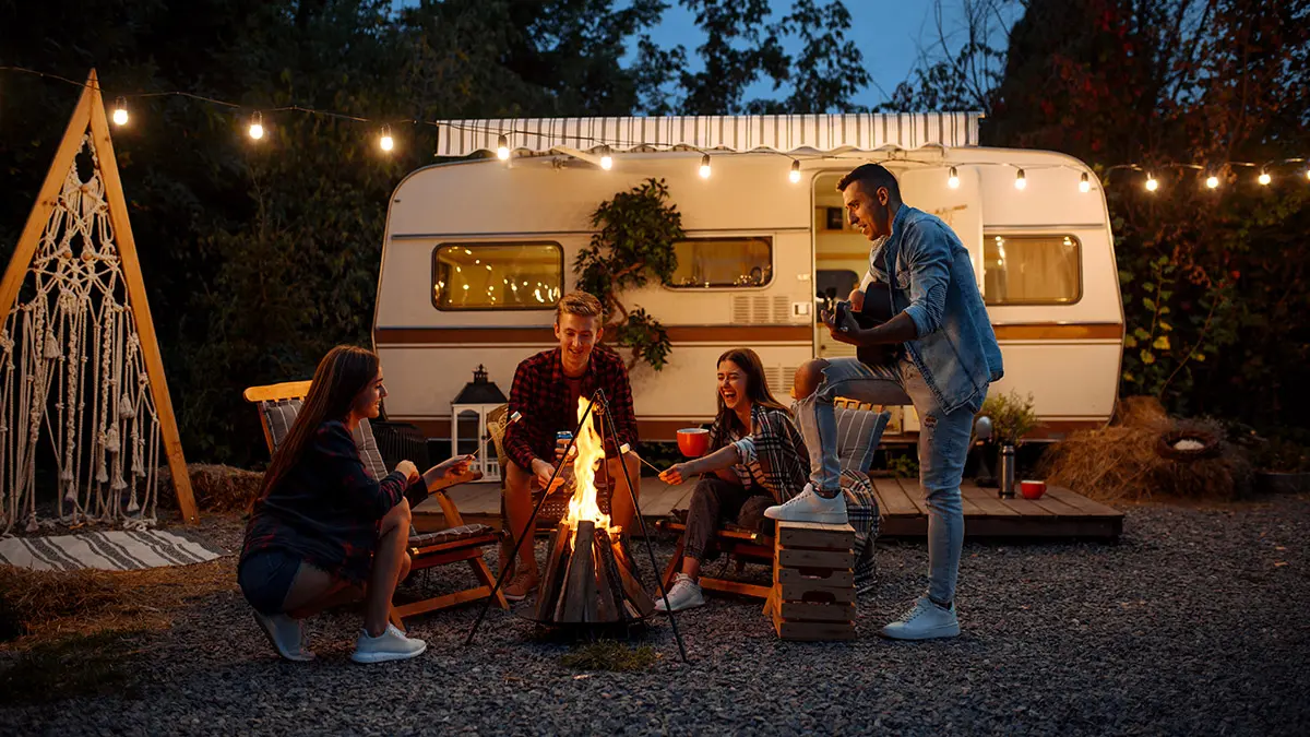 40th birthday ideas with Friends warming themselves by the bonfire, camping