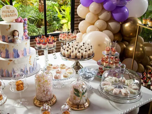 Table of desserts and sweets at the first communion party